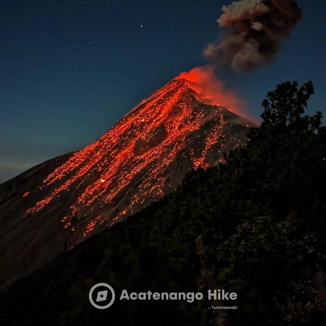 Volcán de Fuego erupting with lava at night, seen from Acatenango